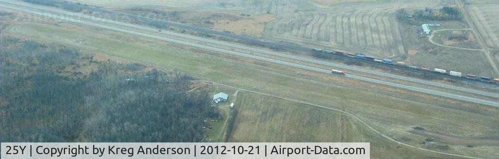 25Y Airport - View of the former New York Mills Municipal Airport (25Y) in New York Mills, MN. Runway runs parallel to US Highway 10, just north of the road. Photo is looking south.