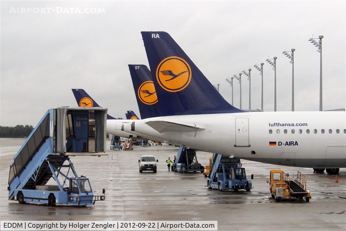 Munich International Airport (Franz Josef Strauß International Airport), Munich Germany (EDDM) - One of these famous blue MUC passenger stairs is drawing near our aircraft....