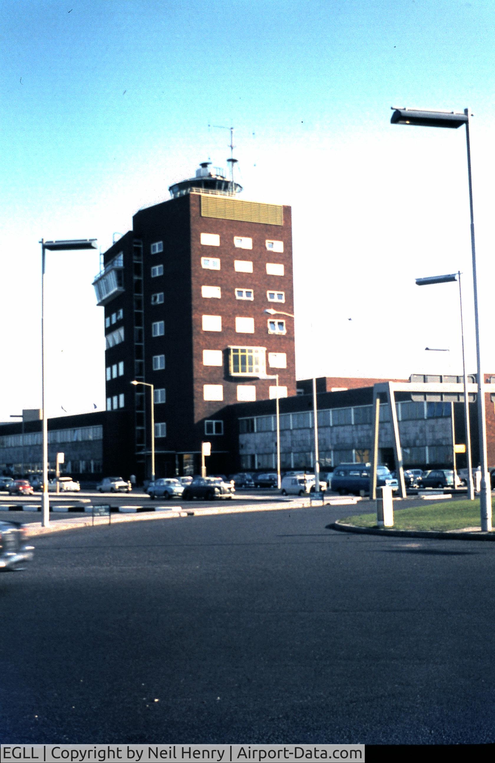 London Heathrow Airport, London, England United Kingdom (EGLL) - Scanned from original slide taken October 1965 from public roadway outside Terminals- View is of original control tower.
