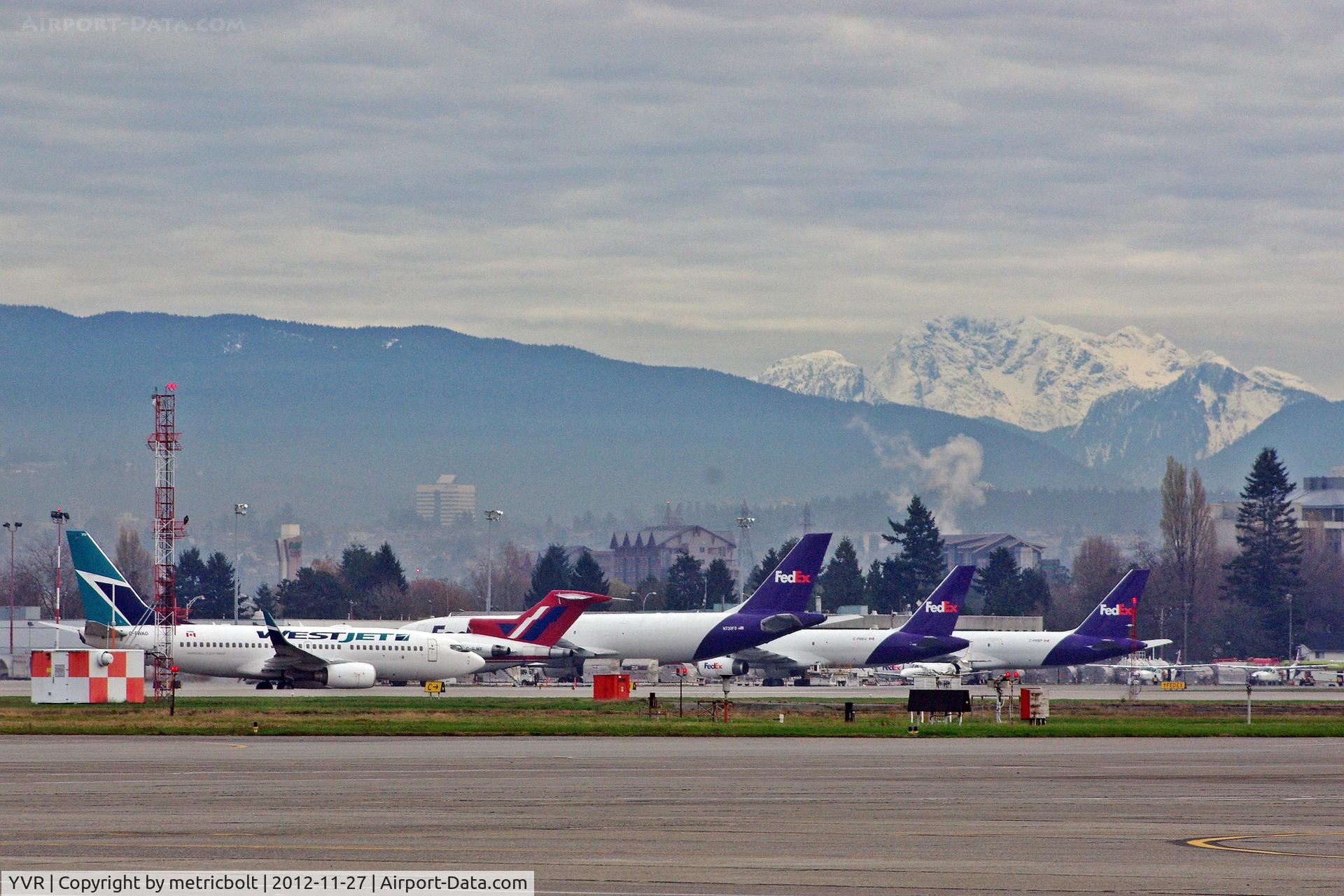 Vancouver International Airport, Vancouver, British Columbia Canada (YVR) - Westjet taxis past cargo area.