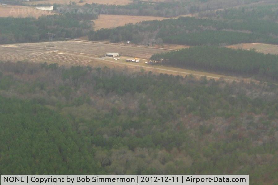 NONE Airport - Looking west at LJ Fussell airfield (uncharted) near Broxton, GA.  Note the high tension lines across the south end of the runway.