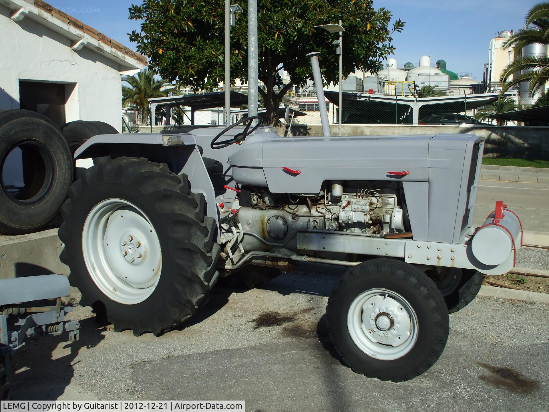 Málaga Airport, Málaga Spain (LEMG) - I assume this tractor was used for moving stairs around and towing an aeroplane every now and then.