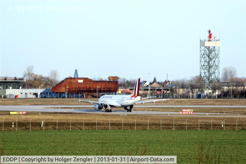 Leipzig/Halle Airport, Leipzig/Halle Germany (EDDP) - View on taxiway echo 6, rwy 26R and fire training center with old radar tower.....