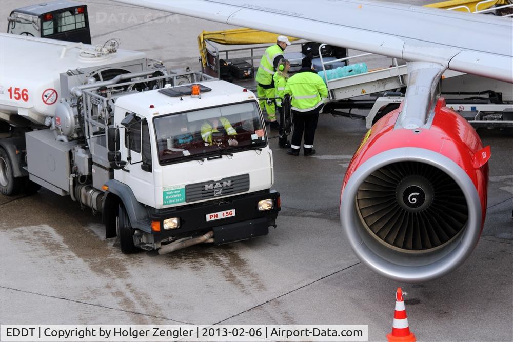 Tegel International Airport (closing in 2011), Berlin Germany (EDDT) - View under a right wing of a B 737-800 of Air Berlin....