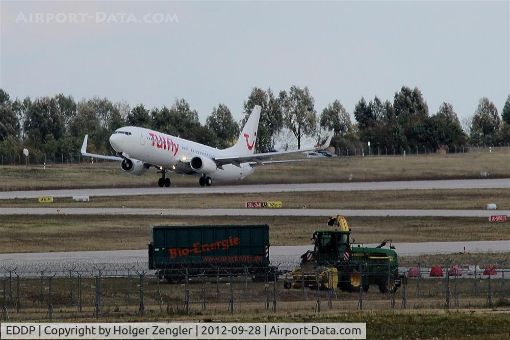 Leipzig/Halle Airport, Leipzig/Halle Germany (EDDP) - Professional mower in action around rwy 08L/26R....