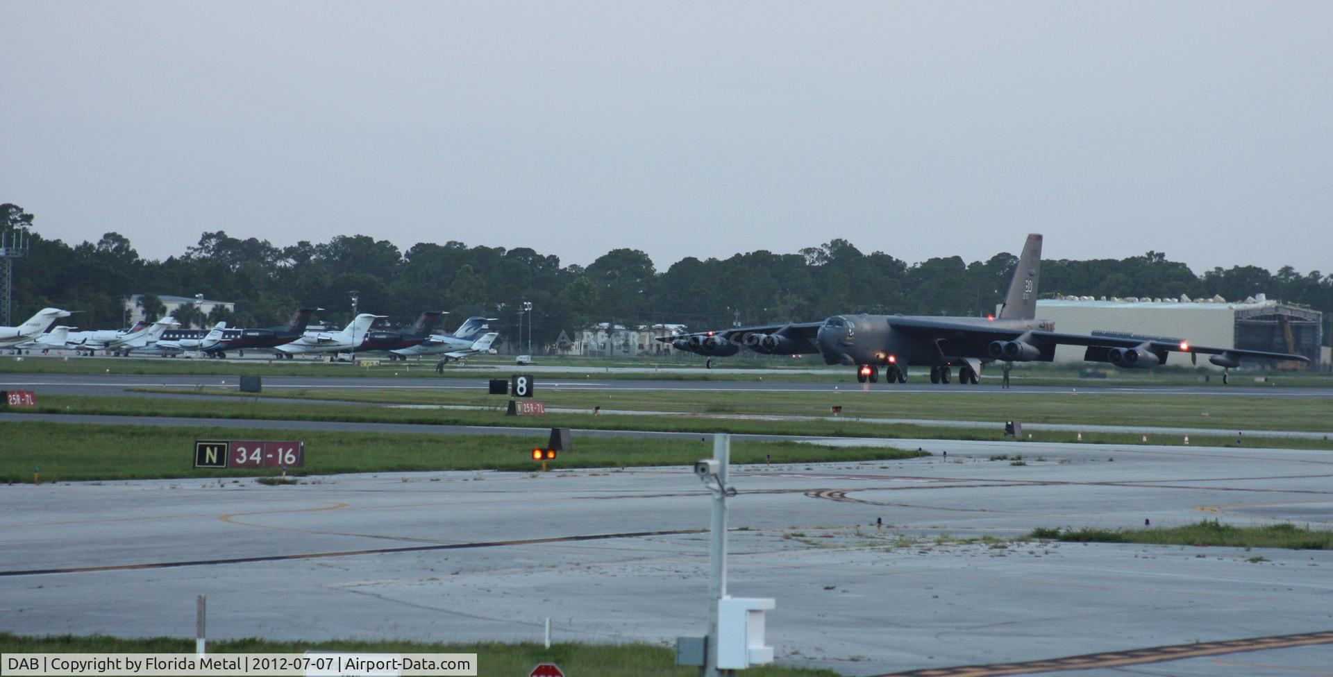 Daytona Beach International Airport (DAB) - B-52 just landed on Rwy 7L, a couple crew members guiding it to back taxi