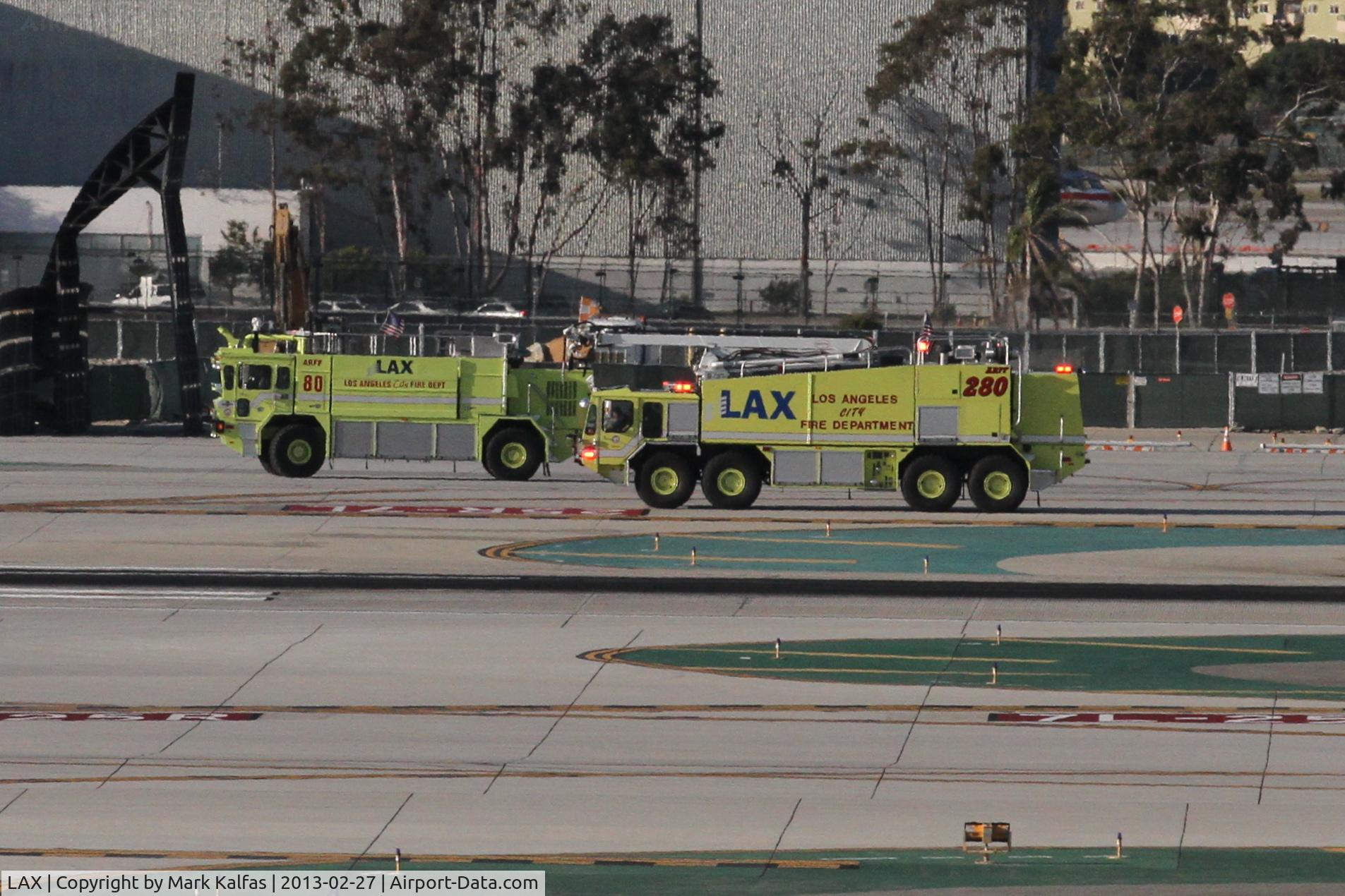 Los Angeles International Airport (LAX) - LAX ARFF 80 and ARFF 280 escorting an aircraft to the American Maintenance Hangar. 
