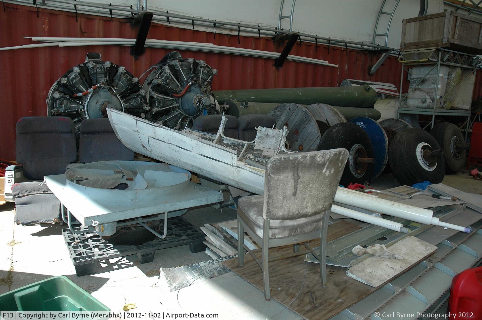 Shell Creek Airpark Airport (F13) - Various Douglas DC-3 parts in the open hangar.
