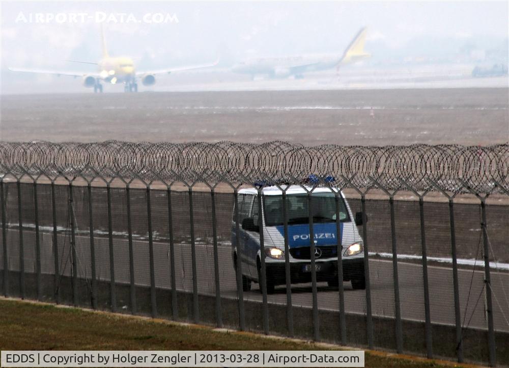 Stuttgart Echterdingen Airport, Stuttgart Germany (EDDS) - Several kinds of traffic behind the barbwire.....