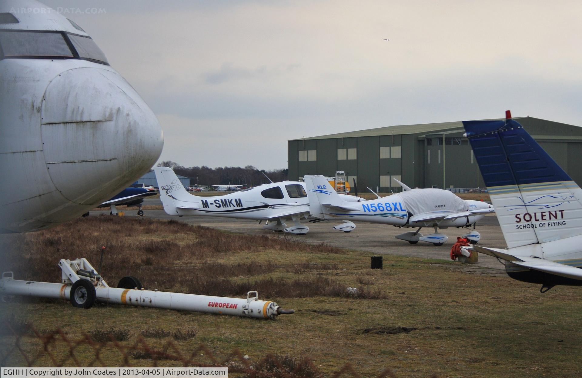 Bournemouth Airport, Bournemouth, England United Kingdom (EGHH) - Busy Bth Handling including fuselage of G-CEAH, a Cirrus and a Liberty XL2.