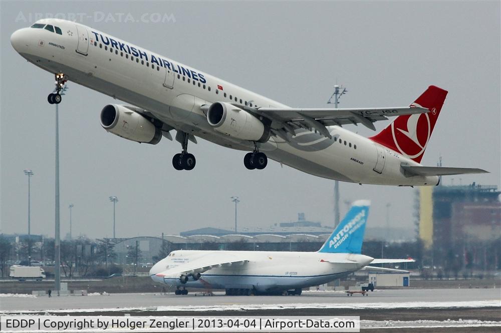 Leipzig/Halle Airport, Leipzig/Halle Germany (EDDP) - Outbound traffic on rwy 08L passing resting AN 124 on apron 3...