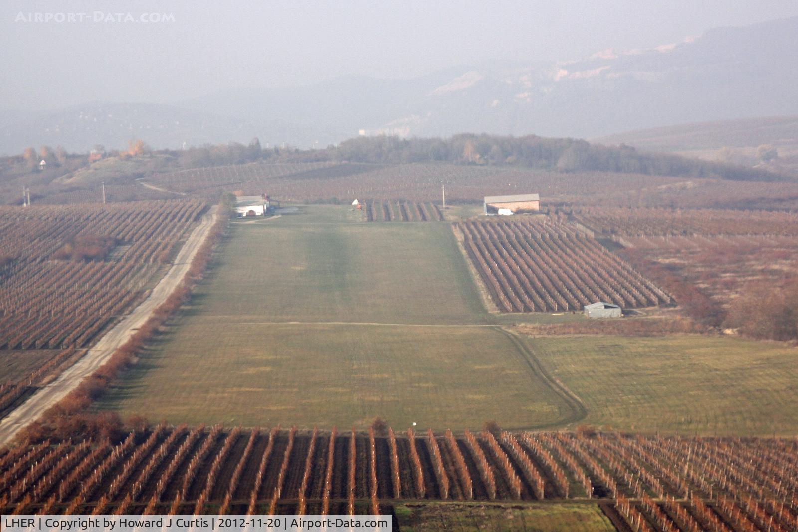 LHER Airport - Eger, Hungary, seen from the lefthand seat of Apollo Fox 7-201. The airport is surrounded by vineyards, which produce the grapes used in the famous Bull's Blood wine.