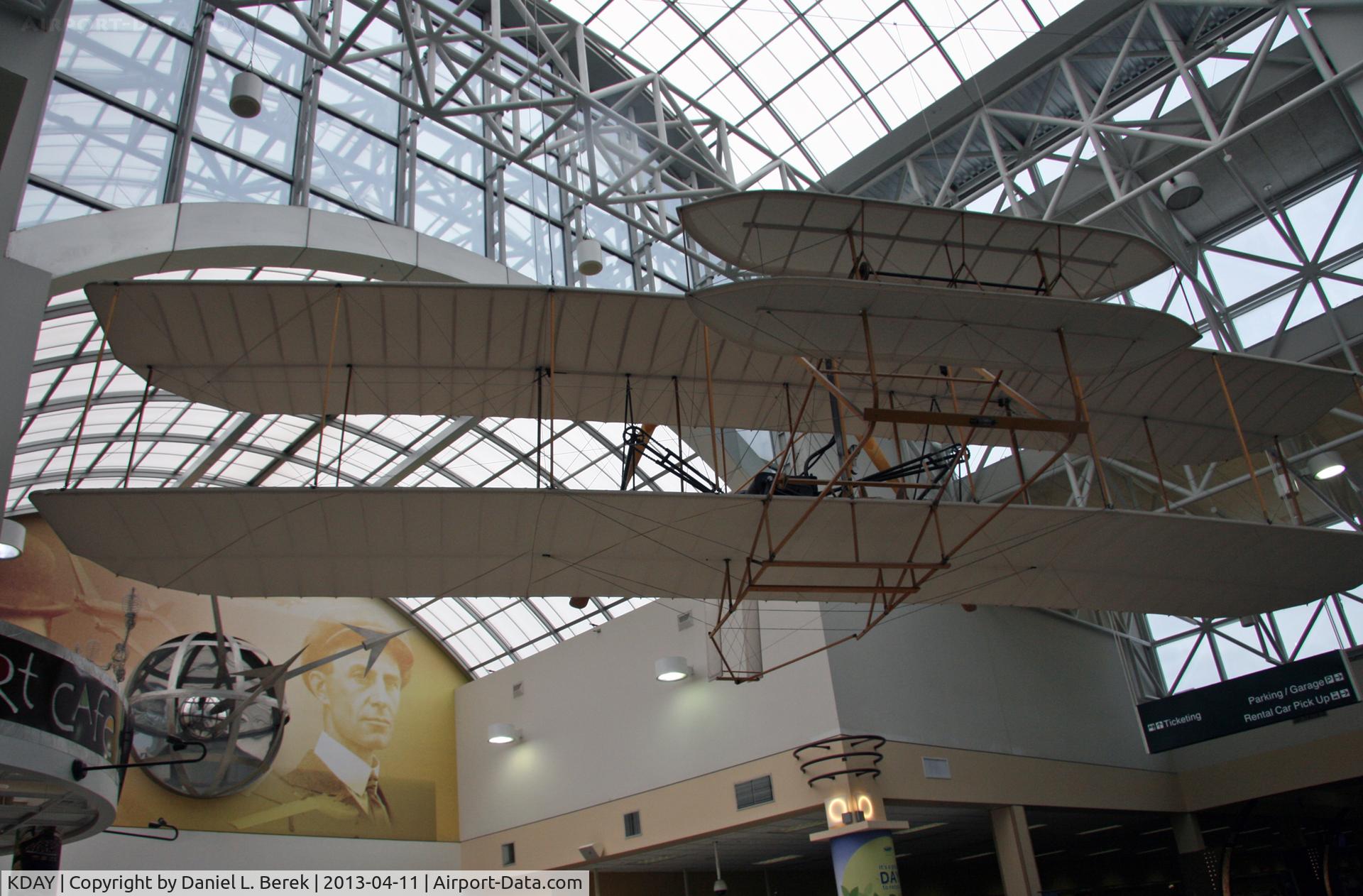 James M Cox Dayton International Airport (DAY) - It is very fitting that Dayton International Airport would have this Wright Flyer replica in the main terminal area, with a mural of the Wright Brothers as a backdrop.