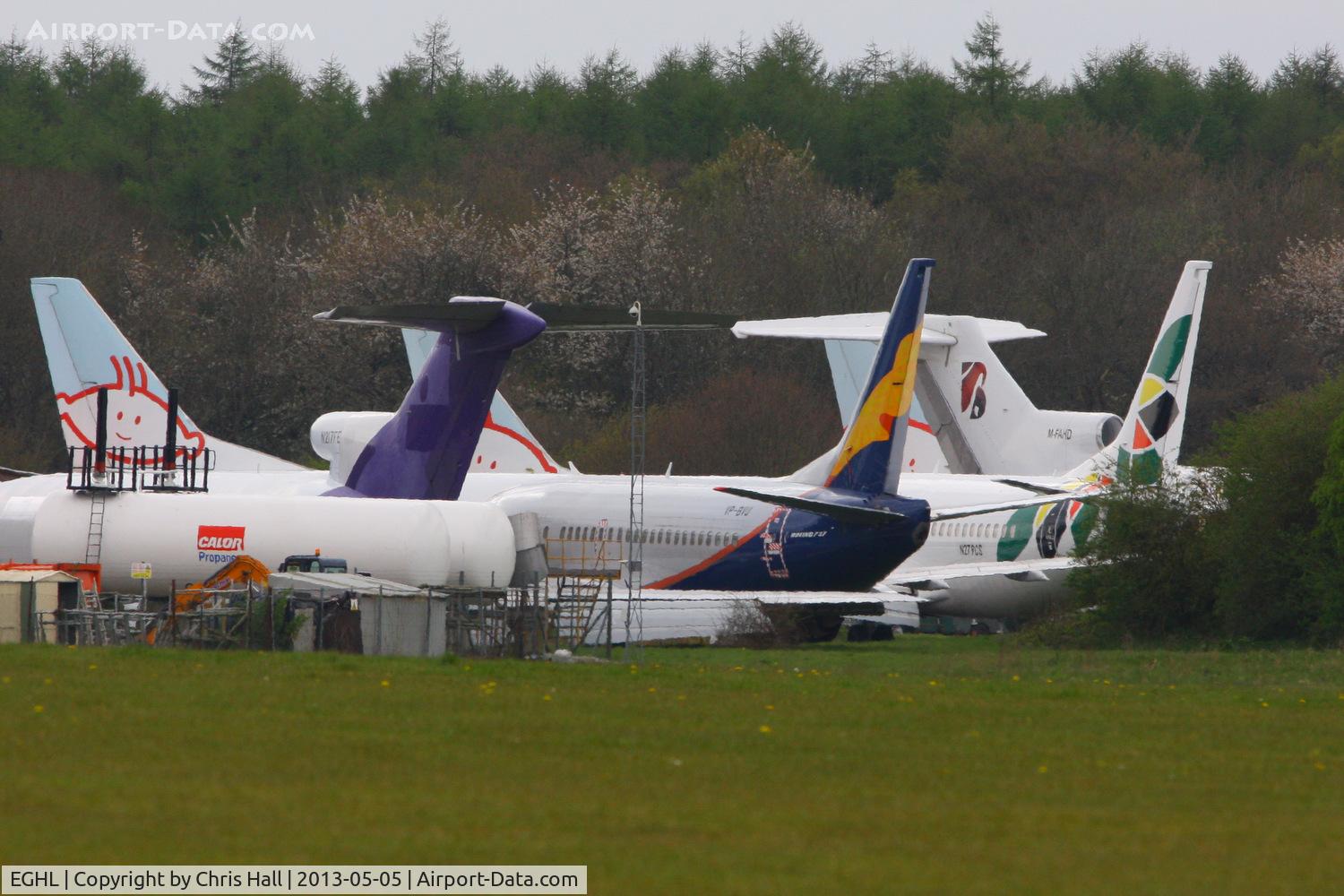 Lasham Airfield Airport, Basingstoke, England United Kingdom (EGHL) - storage area at Lasham, three former BMI Baby B737's at the rear and from L to R are N217FE Boeing 727 2S2F, VP-BVU Boeing 737-5Q8, N279CS	Boeing 737-33V and M-FAHD	Boeing 727-76