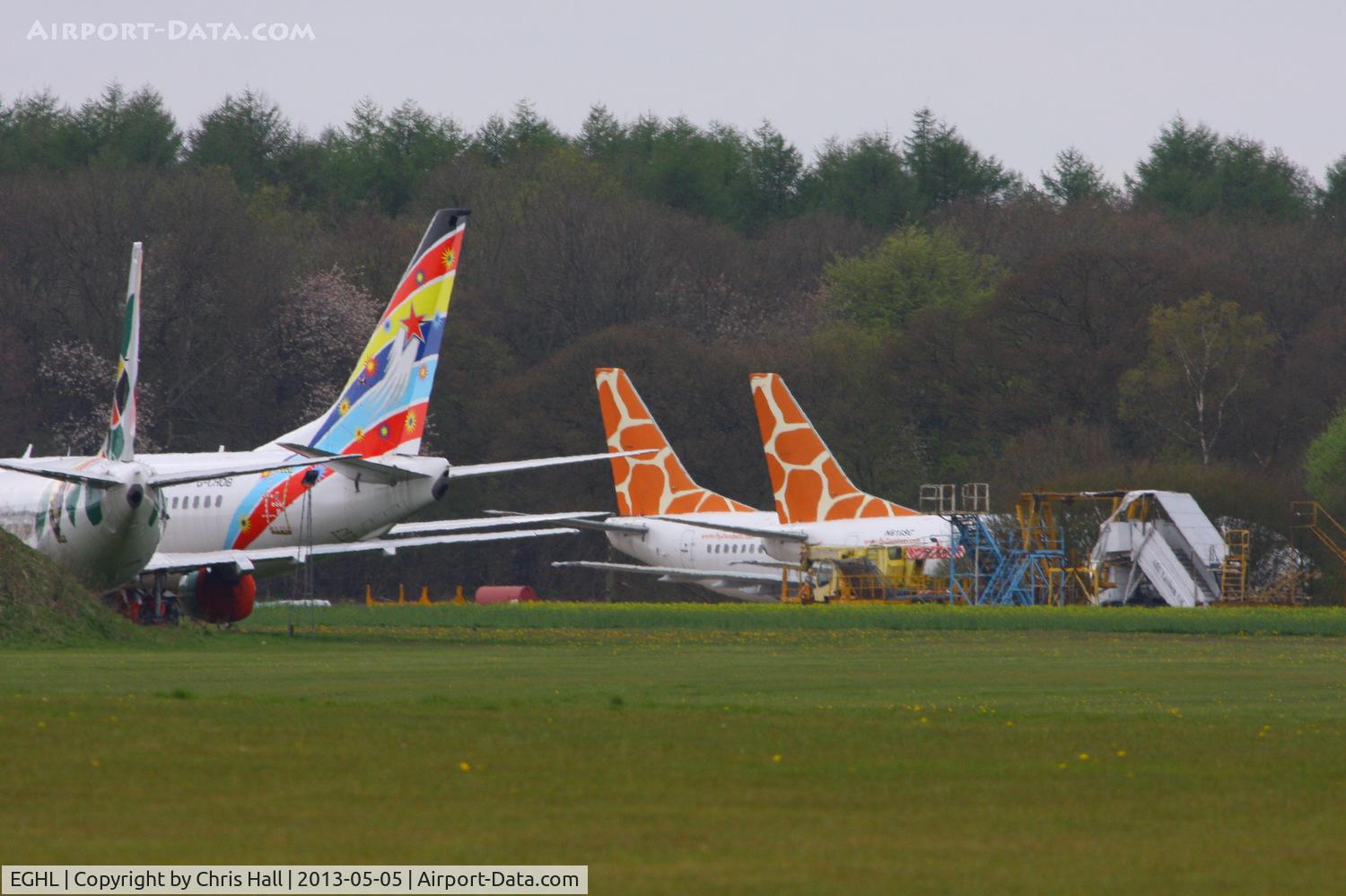 Lasham Airfield Airport, Basingstoke, England United Kingdom (EGHL) - In storage at Lasham, from L to R N280CS Boeing 737-33V, G-CHOB Boeing 737-883, N615SC Boeing 737-5Y0 and N616SC Boeing 737-5Y0