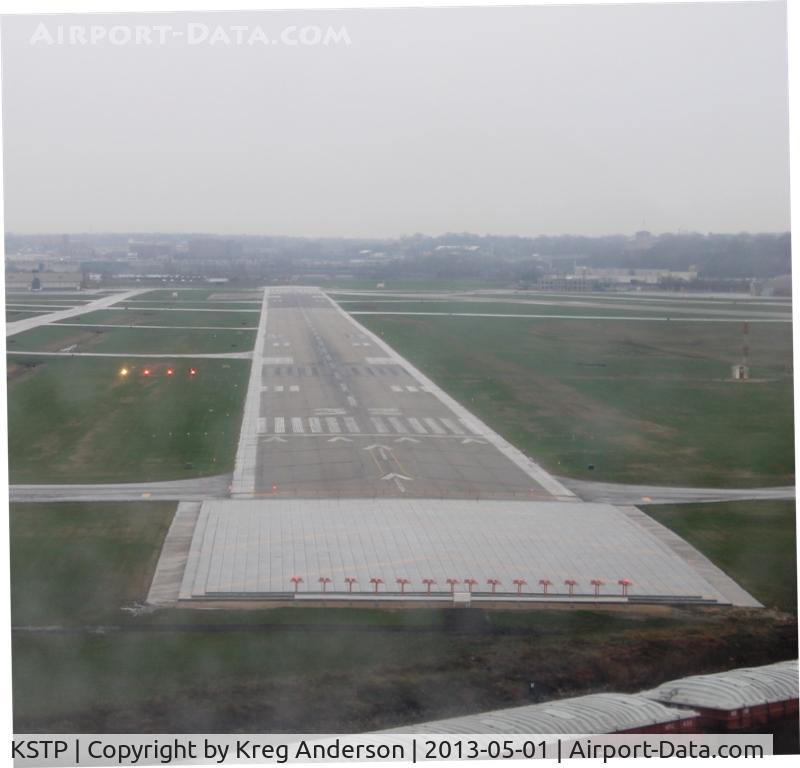St Paul Downtown Holman Fld Airport (STP) - On short final for runway 32 on a rainy day at St. Paul Downtown Airport.