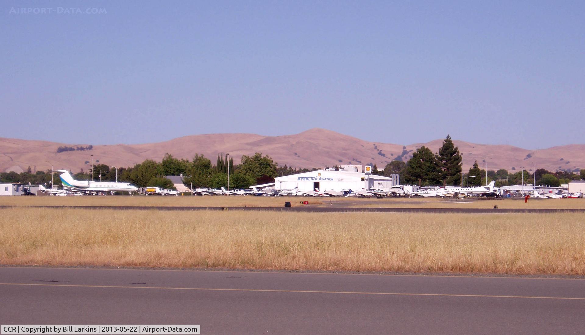 Buchanan Field Airport (CCR) - Tower and hangar area from the West side of the field at 6pm.