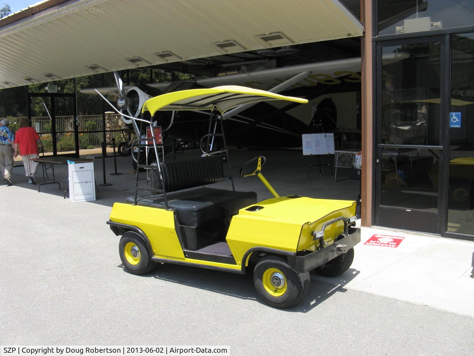 Santa Paula Airport (SZP) - The airport has many forms of personal ground transport. Here is an electric vehicle that can cleverly seat four, with two perhaps in the shade.