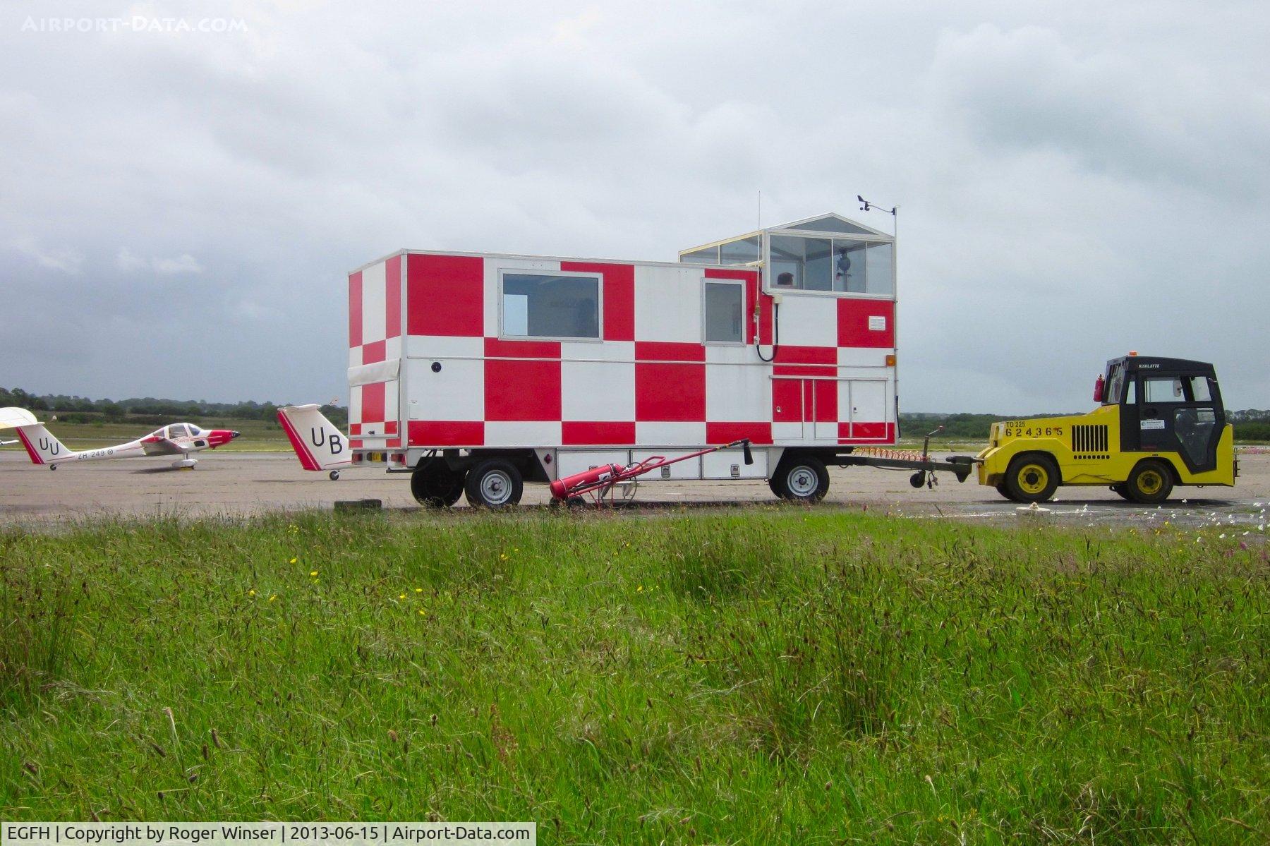 Swansea Airport, Swansea, Wales United Kingdom (EGFH) - Runway caravan, Charlette diesel tug and the two Grob Vigilant T.1 motor gliders operated by 636 VGS at Swansea Airport.