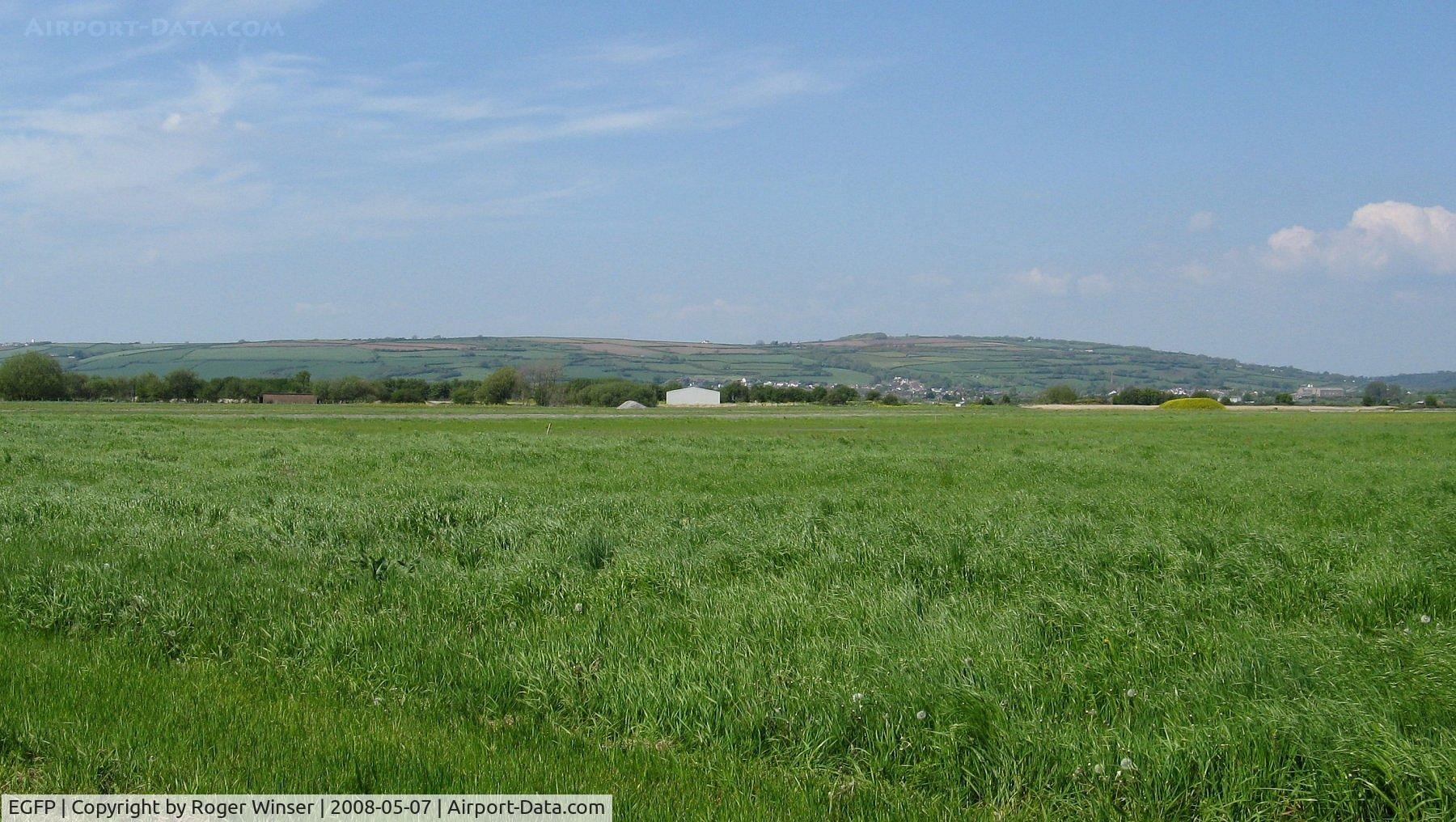 Pembrey Airport, Pembrey, Wales United Kingdom (EGFP) - View across Runway 04/22 to hangar.