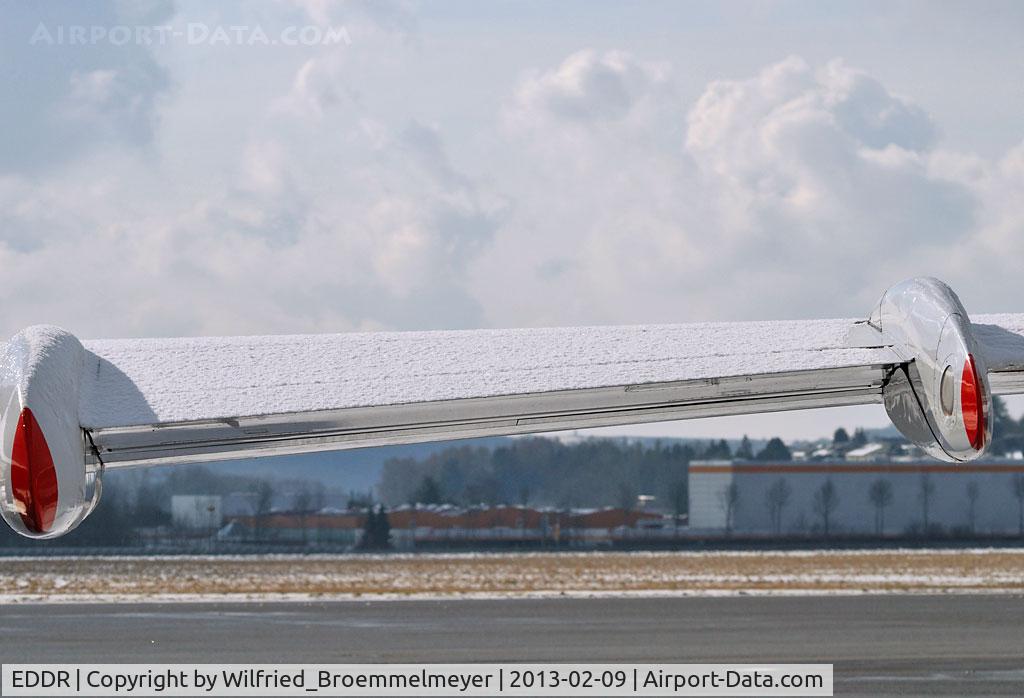 Saarbrücken Airport, Saarbrücken Germany (EDDR) - A cold winter day at Saarbrucken. Snow on Wing.