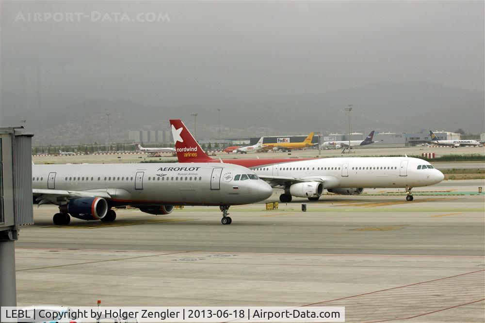 Barcelona International Airport, Barcelona Spain (LEBL) - Two aircraft with code VQ in front of Terminal 1......