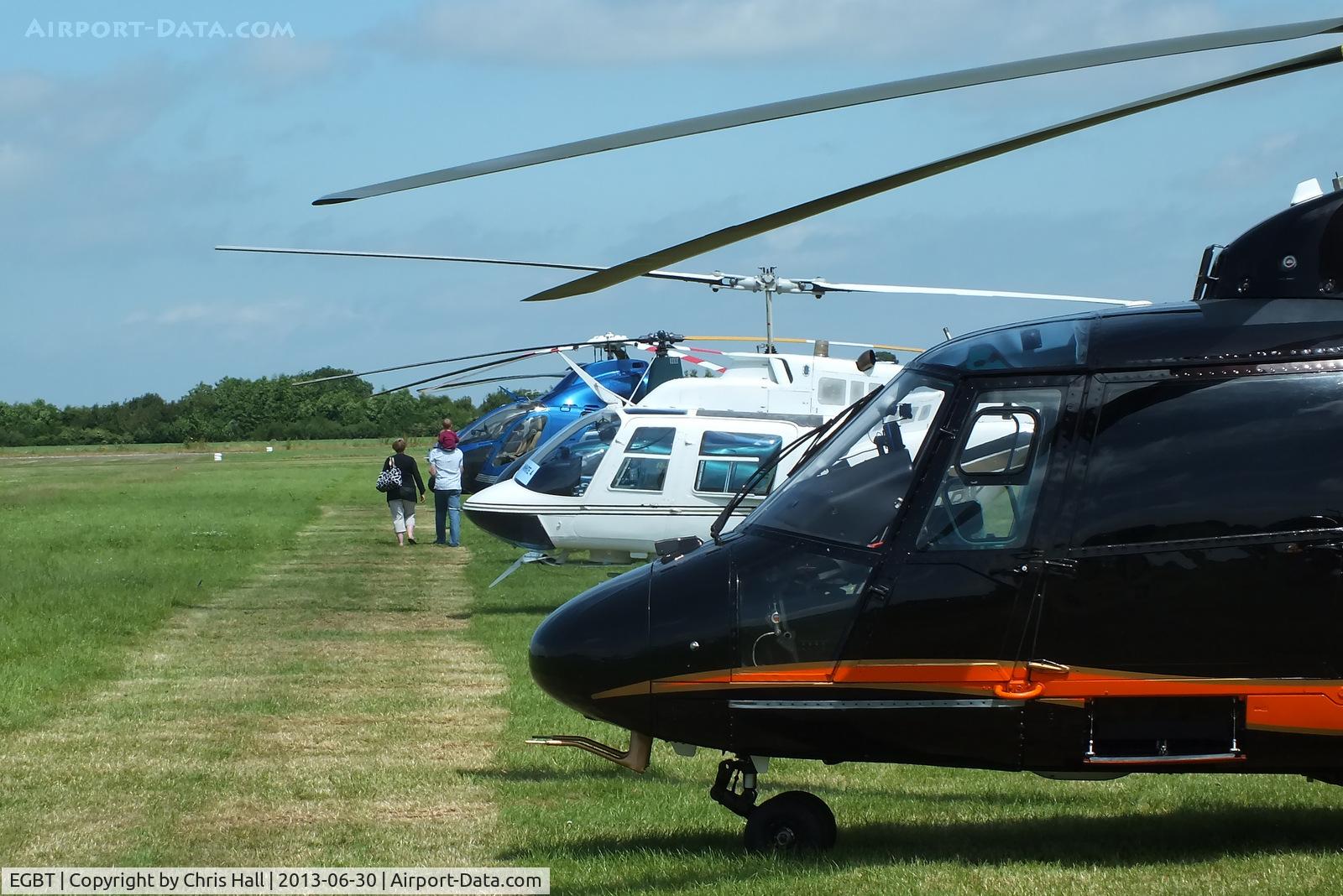 Turweston Aerodrome Airport, Turweston, England United Kingdom (EGBT) - line up of helicopters being used for ferrying race fans to the British F1 Grand Prix at Silverstone