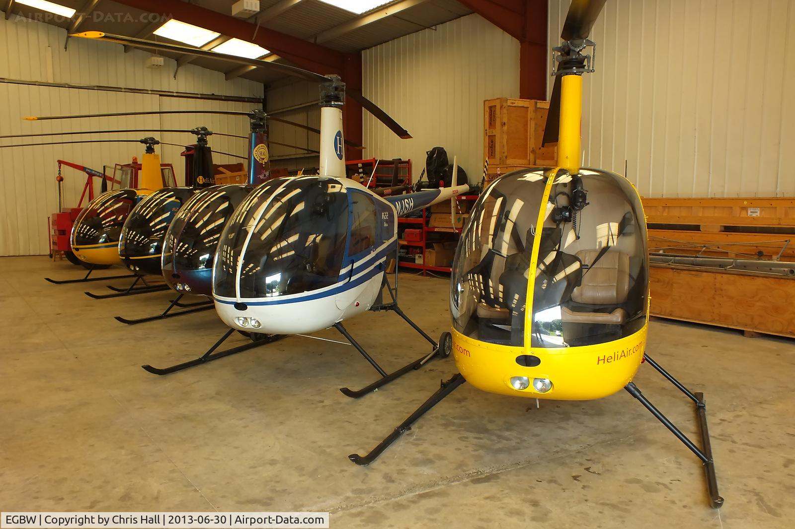 Wellesbourne Mountford Airfield Airport, Wellesbourne, England United Kingdom (EGBW) - R22's in the Heli Air hangar at Wellesbourne Mountford