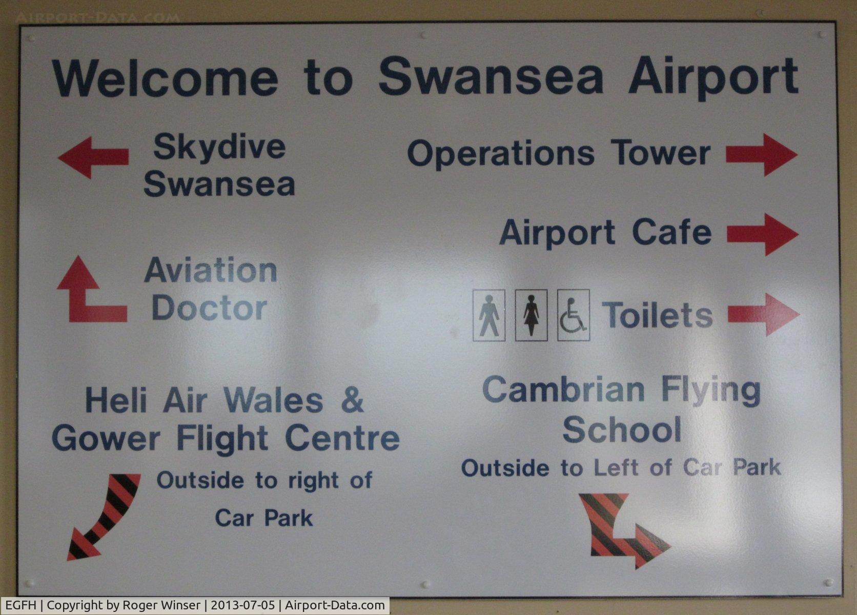 Swansea Airport, Swansea, Wales United Kingdom (EGFH) - Sign showing some of the operators based at Swansea Airport.