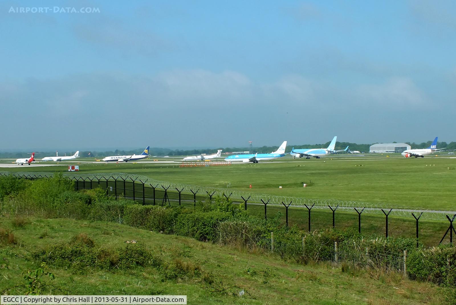 Manchester Airport, Manchester, England United Kingdom (EGCC) - Helvetic Fokker 100, Flybe Embraer, Ryanair B737, Flybe Dash-8, KLM 737, Jetairfly B767 and SAS B737 waiting to depart from RW23L at Manchester Airport
