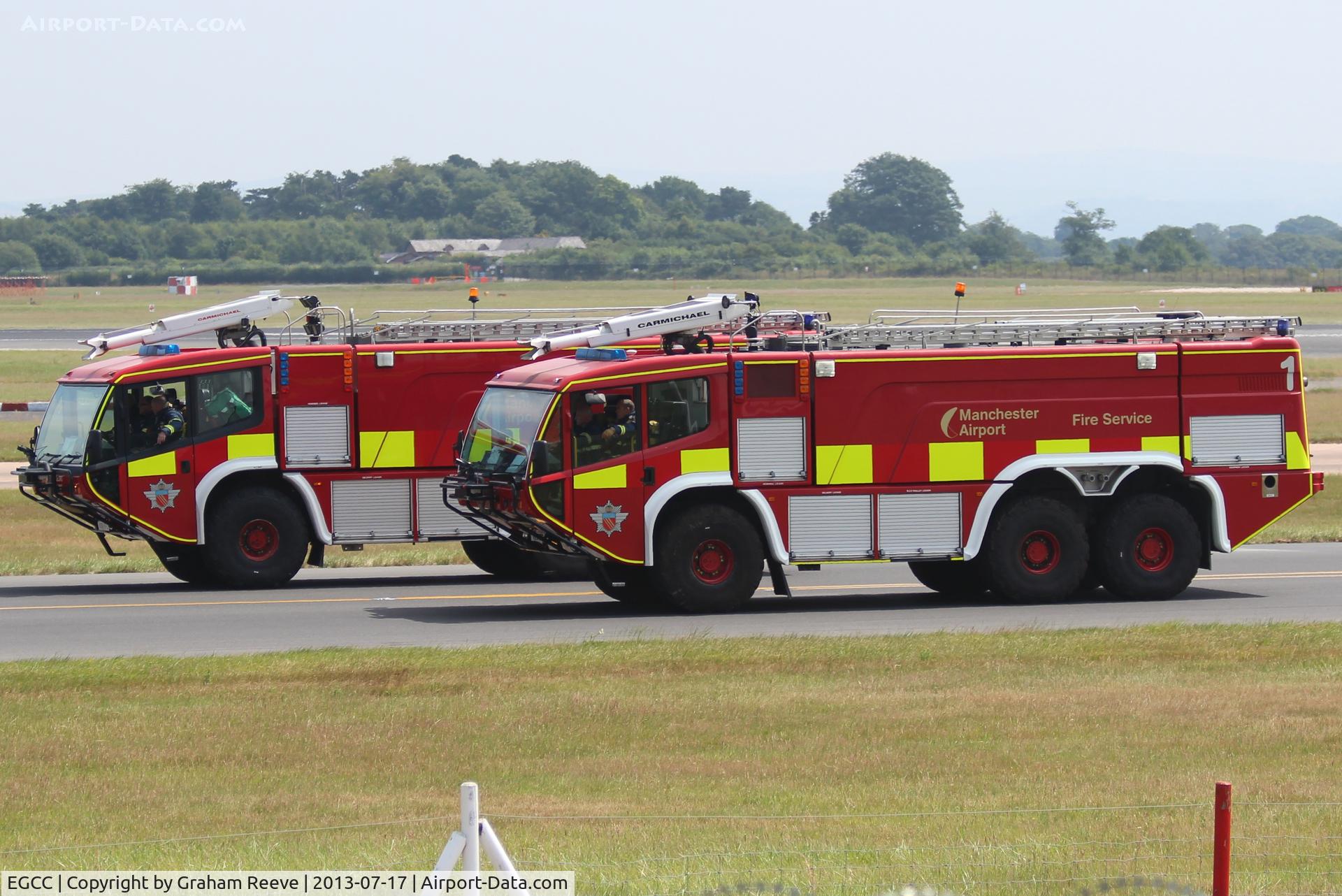 Manchester Airport, Manchester, England United Kingdom (EGCC) - Two of Manchester Airport's fire engines. 