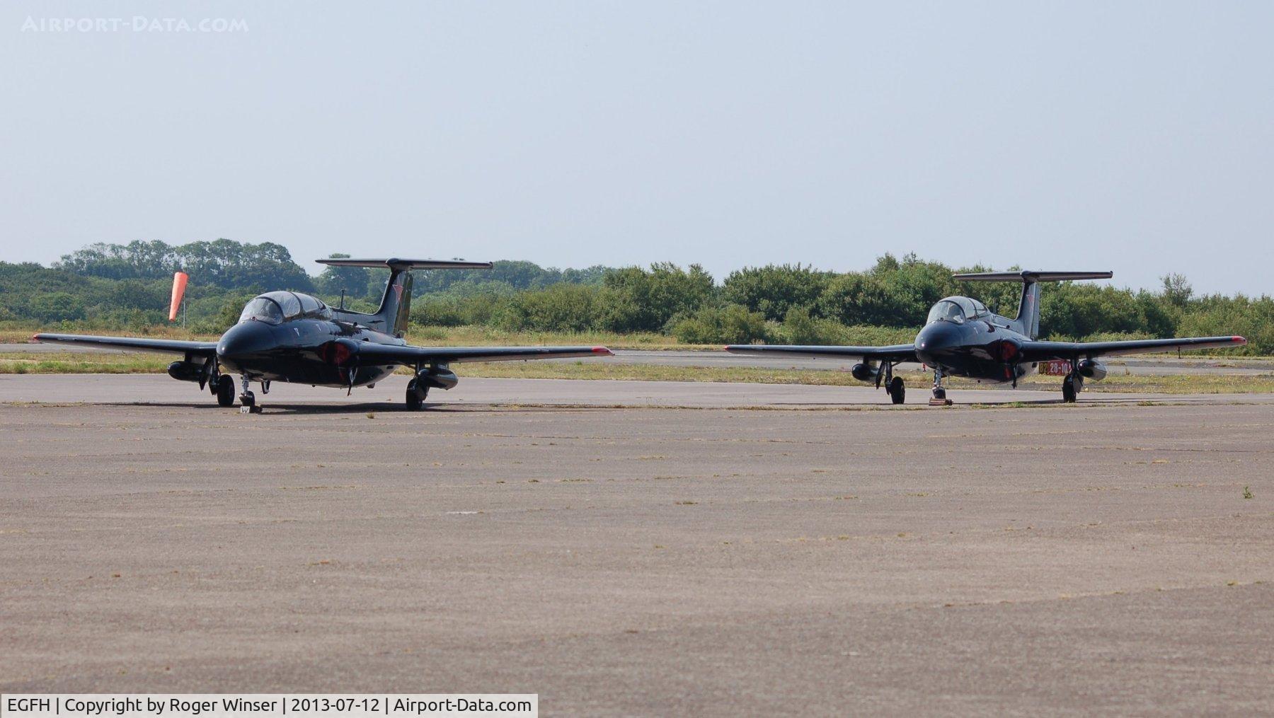 Swansea Airport, Swansea, Wales United Kingdom (EGFH) - Line up of Aero L-29 Delfins of the Red Star Rebels at Swansea Airport prior to displaying at the Wales National Air Show.