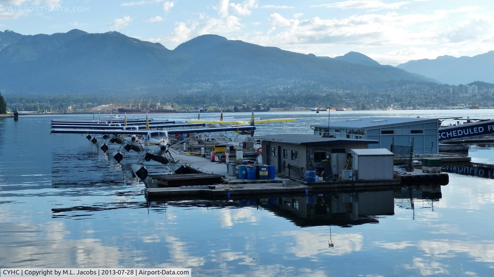 Vancouver Harbour Water Airport (Vancouver Coal Harbour Seaplane Base), Vancouver, British Columbia Canada (CYHC) - Early Sunday morning overlooking Harbour Air terminal in Coal Harbour.  The North Shore mountains line the background.