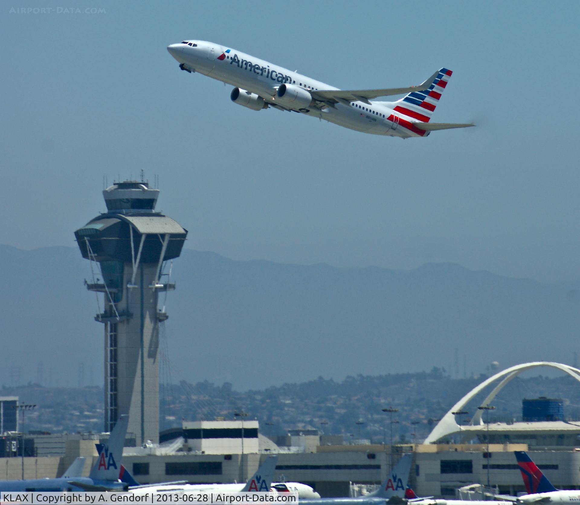 Los Angeles International Airport (LAX) - American Airlines (N804NN) is departing between the Tower and the Tom Bradley Building