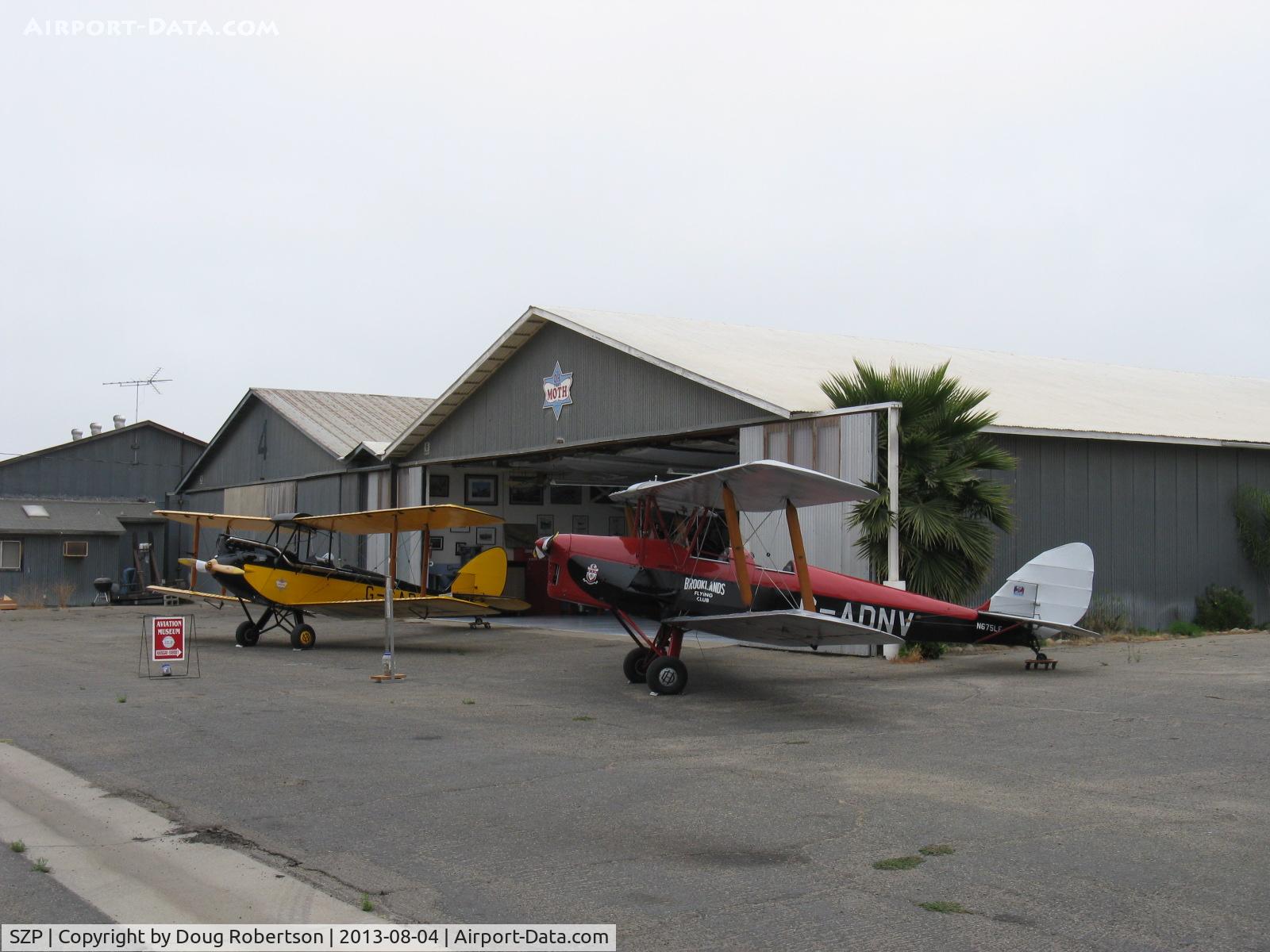 Santa Paula Airport (SZP) - The David Watson Aviation Museum of Santa Paula hangar-British DeHavilland Tiger and Gipsy Moth Bipes live here. A good DeHavilland aircraft engine collection, too!