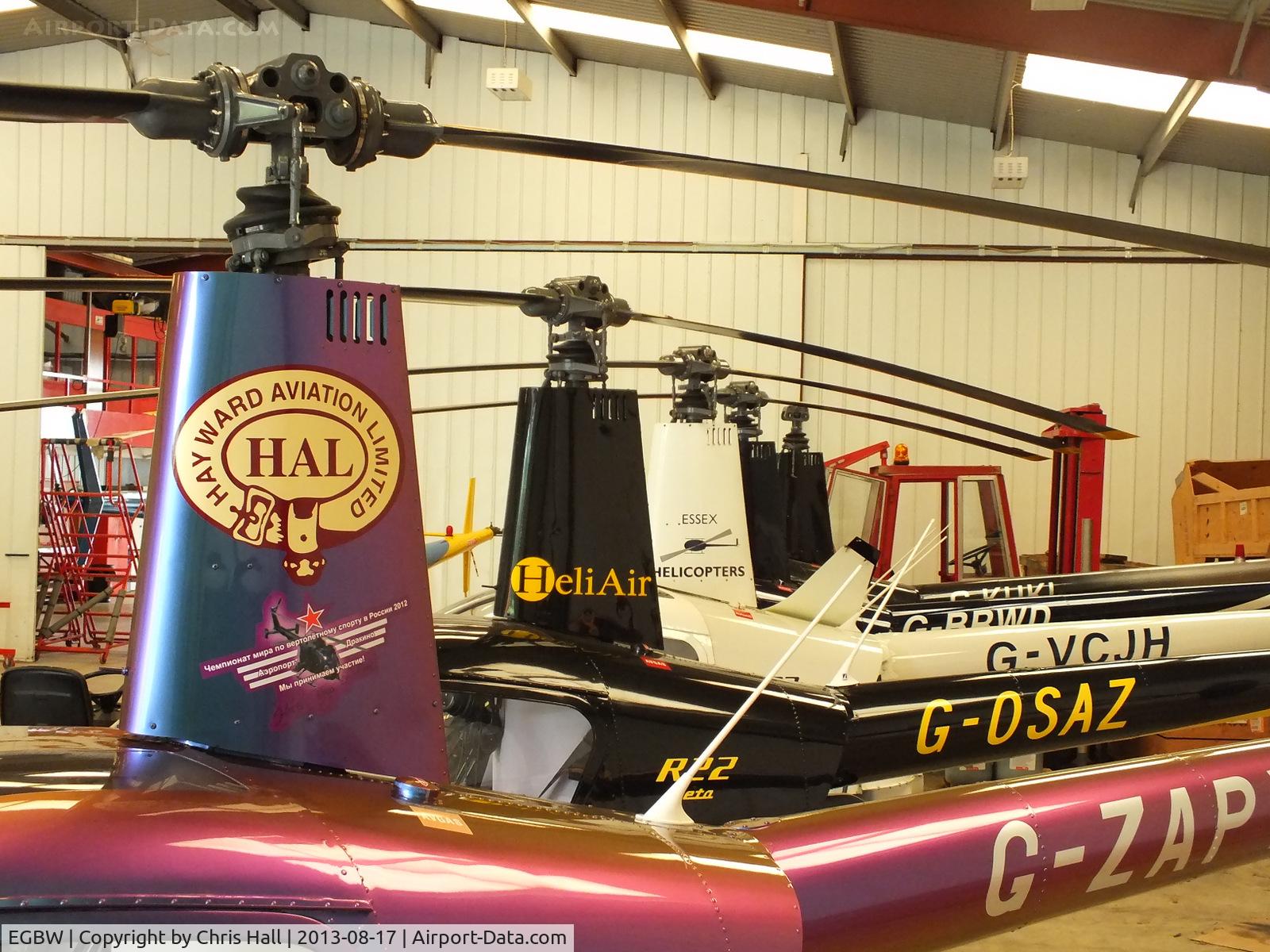 Wellesbourne Mountford Airfield Airport, Wellesbourne, England United Kingdom (EGBW) - R22's in the Heli Air hangar at Wellesbourne Mountford