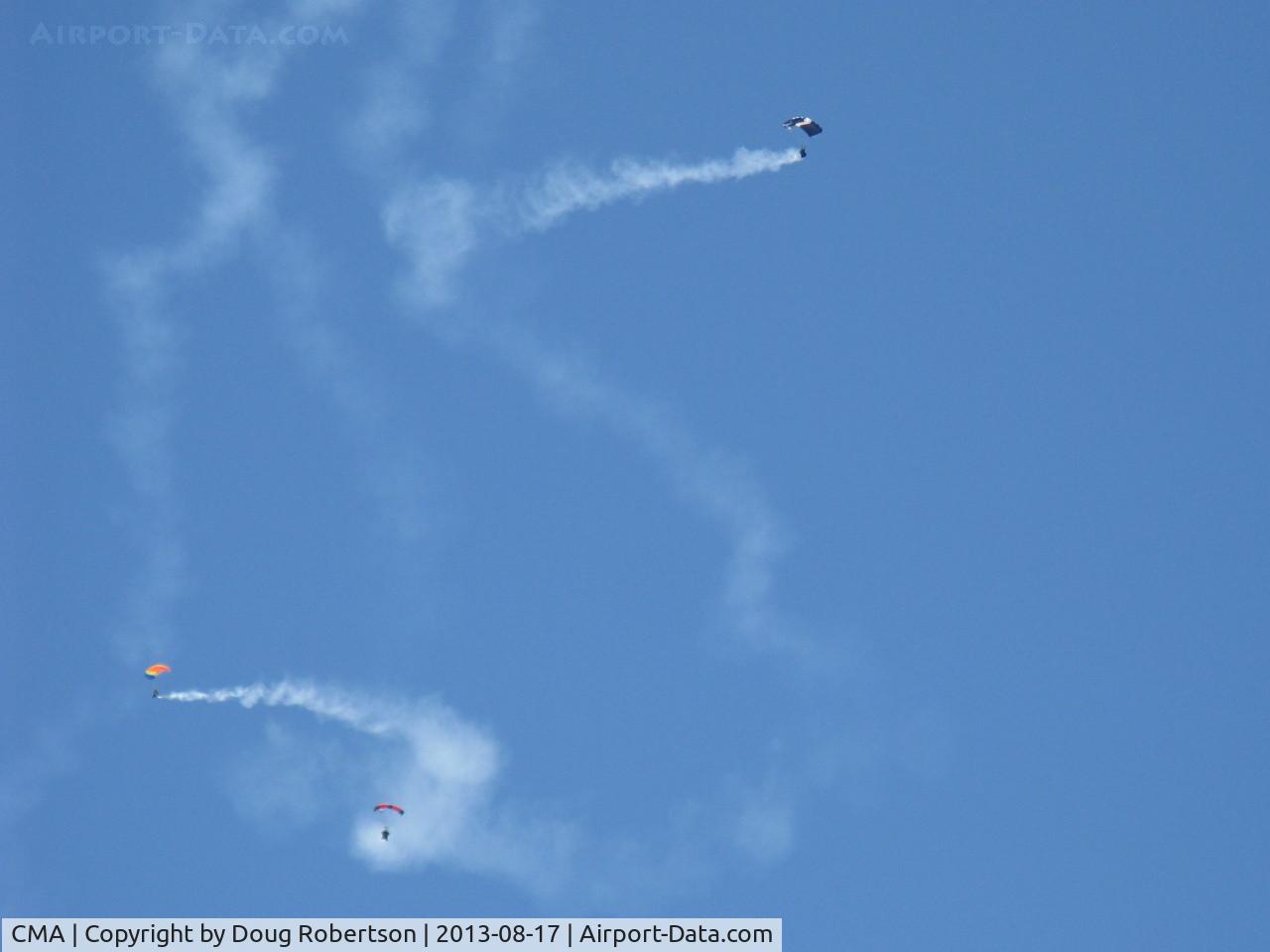 Camarillo Airport (CMA) - Three parachutists doing stunts with smoke opening the Wings Over Camarillo Airshow 2013.