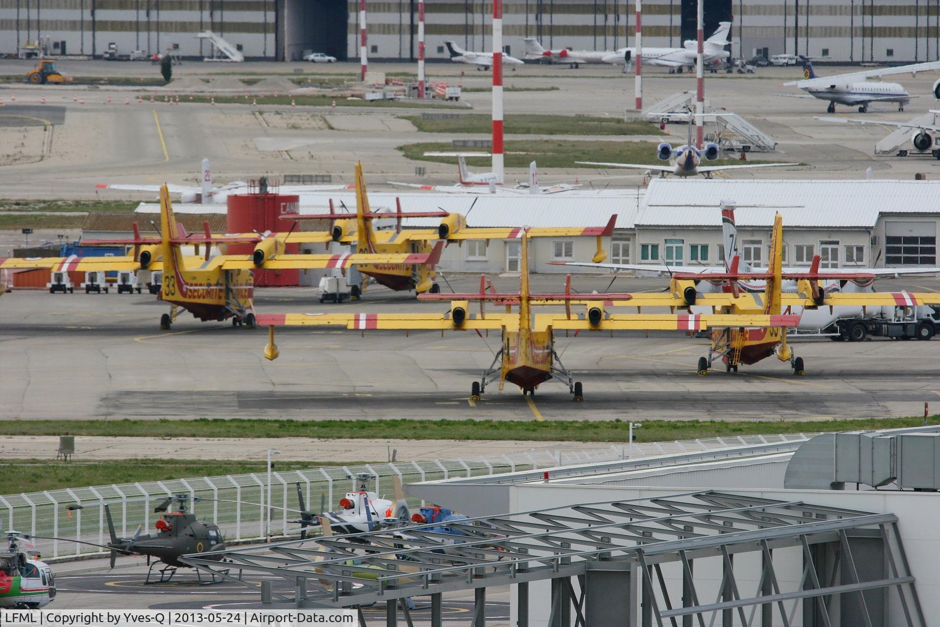 Marseille Provence Airport, Marseille France (LFML) - Canadair CL-415 Parking area. In the foreground Eurocopter workshops, Marseille-Provence Airport (LFML-MRS)