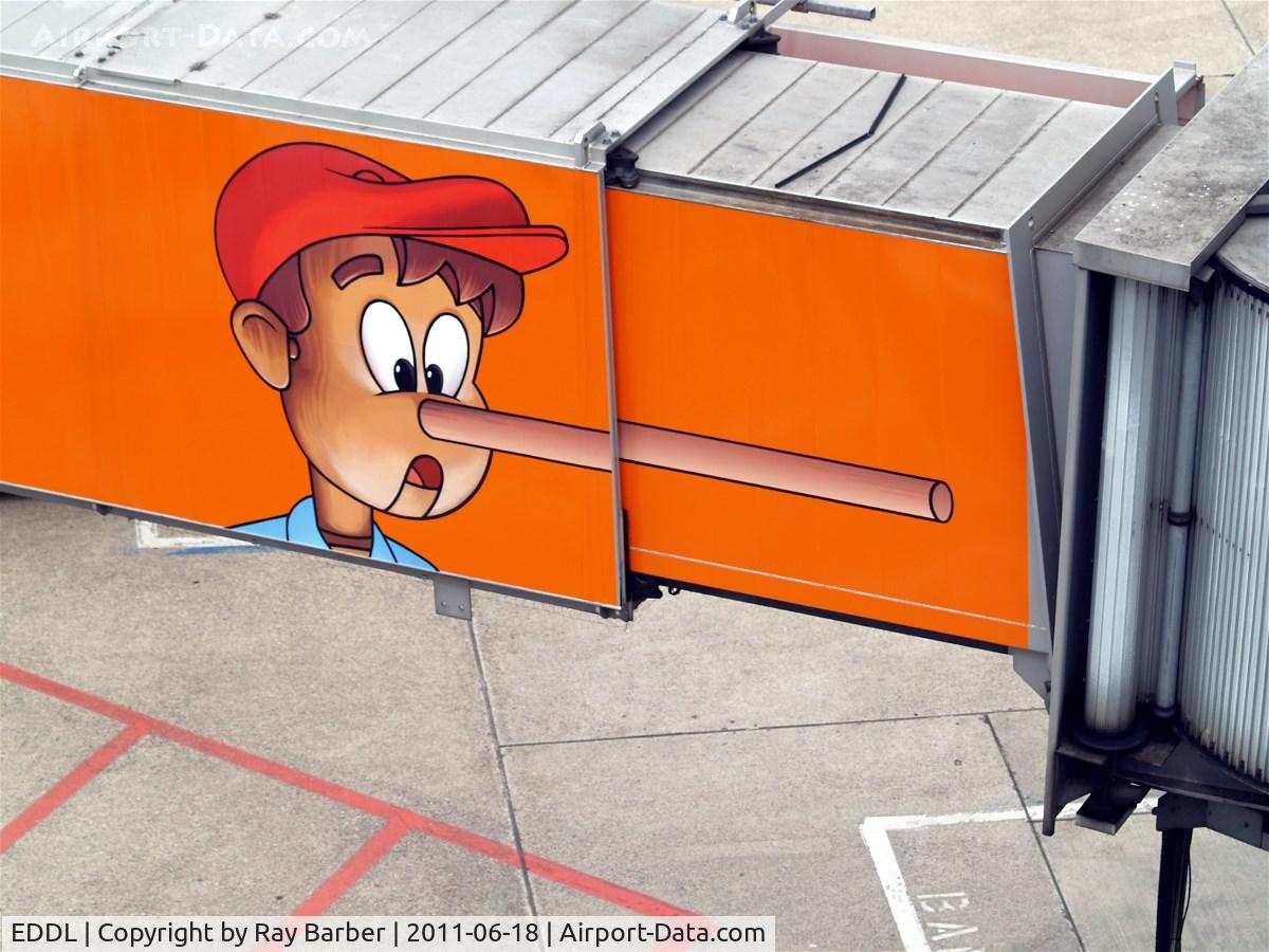 Düsseldorf International Airport, Düsseldorf Germany (EDDL) - Pinnocio nose art pier. Moves out and extends nose.