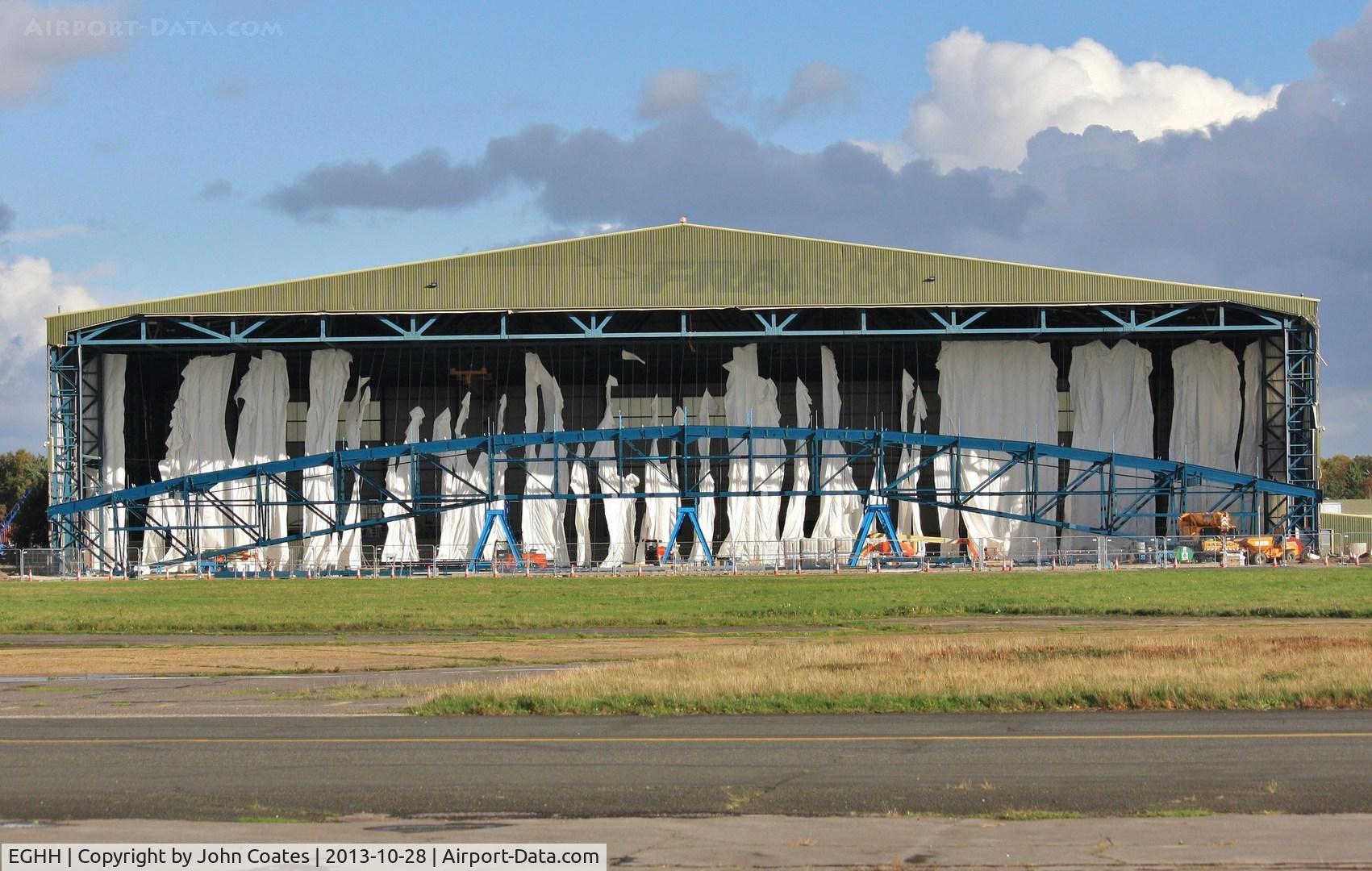 Bournemouth Airport, Bournemouth, England United Kingdom (EGHH) - Building screen for hangar extension shredded in violent storm