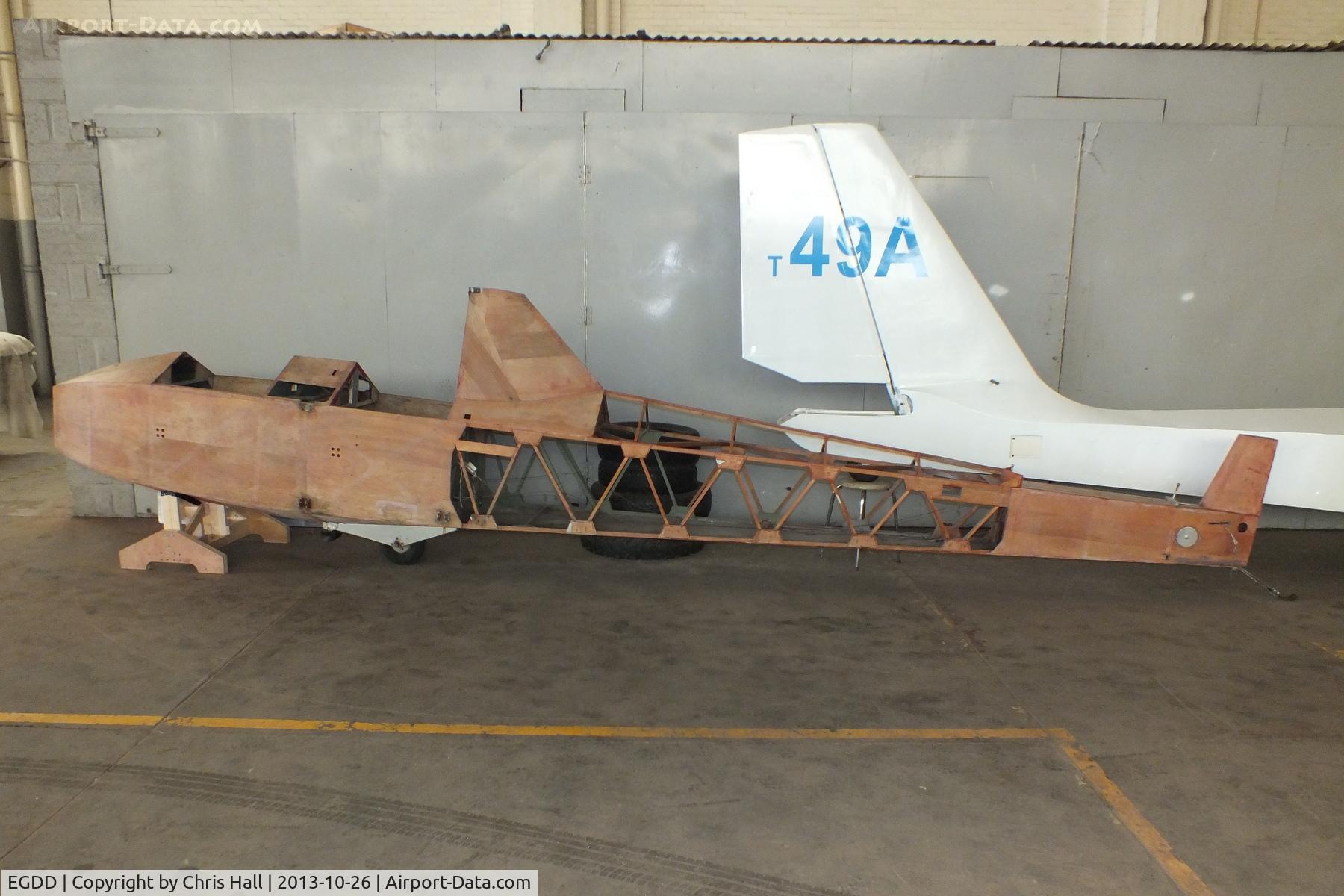 EGDD Airport - unidentified glider fuselage in the hangar at Bicester