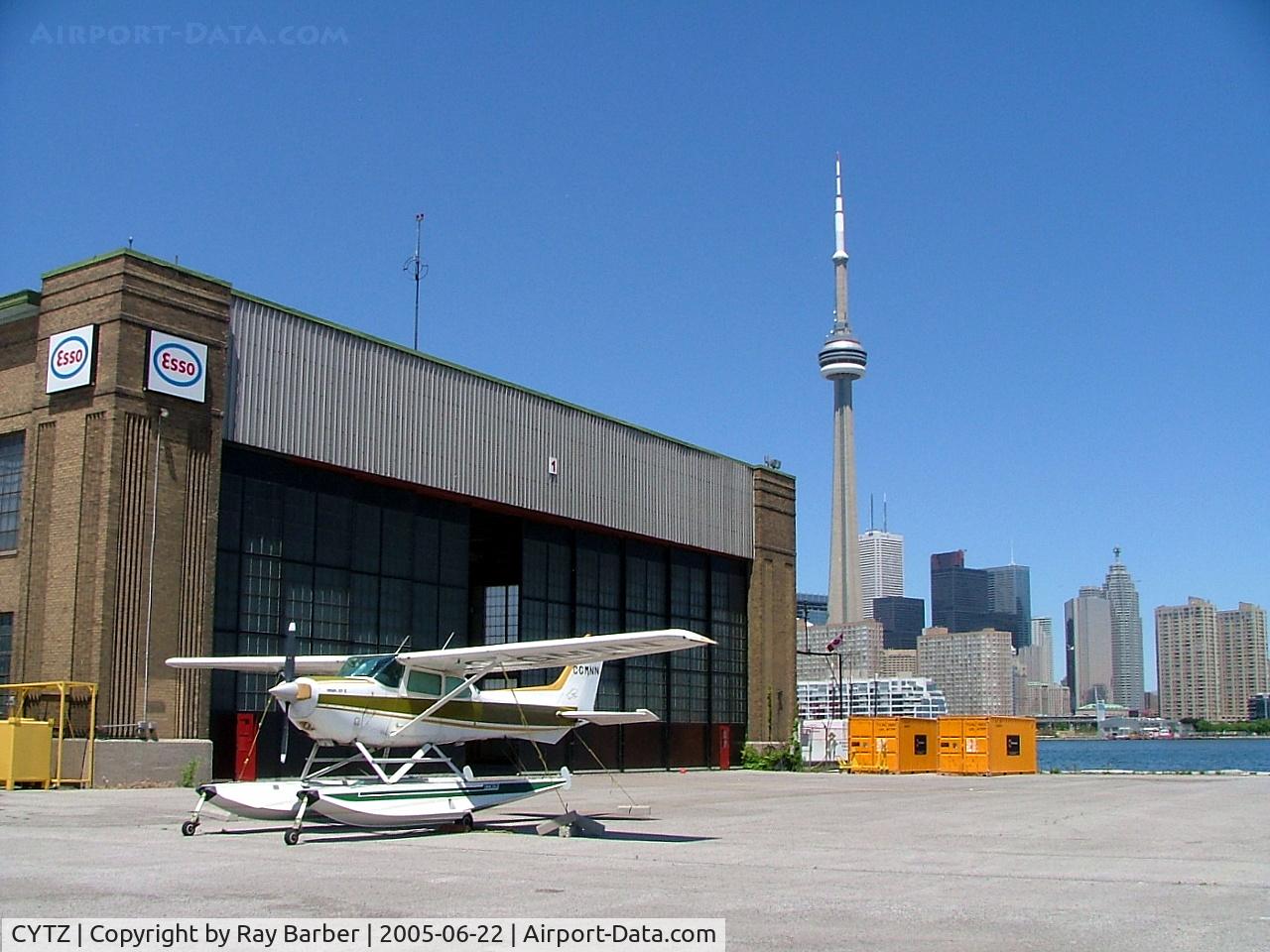 Toronto City Centre Airport, Toronto, Ontario Canada (CYTZ) - Showing the old hangar and skyline behind.