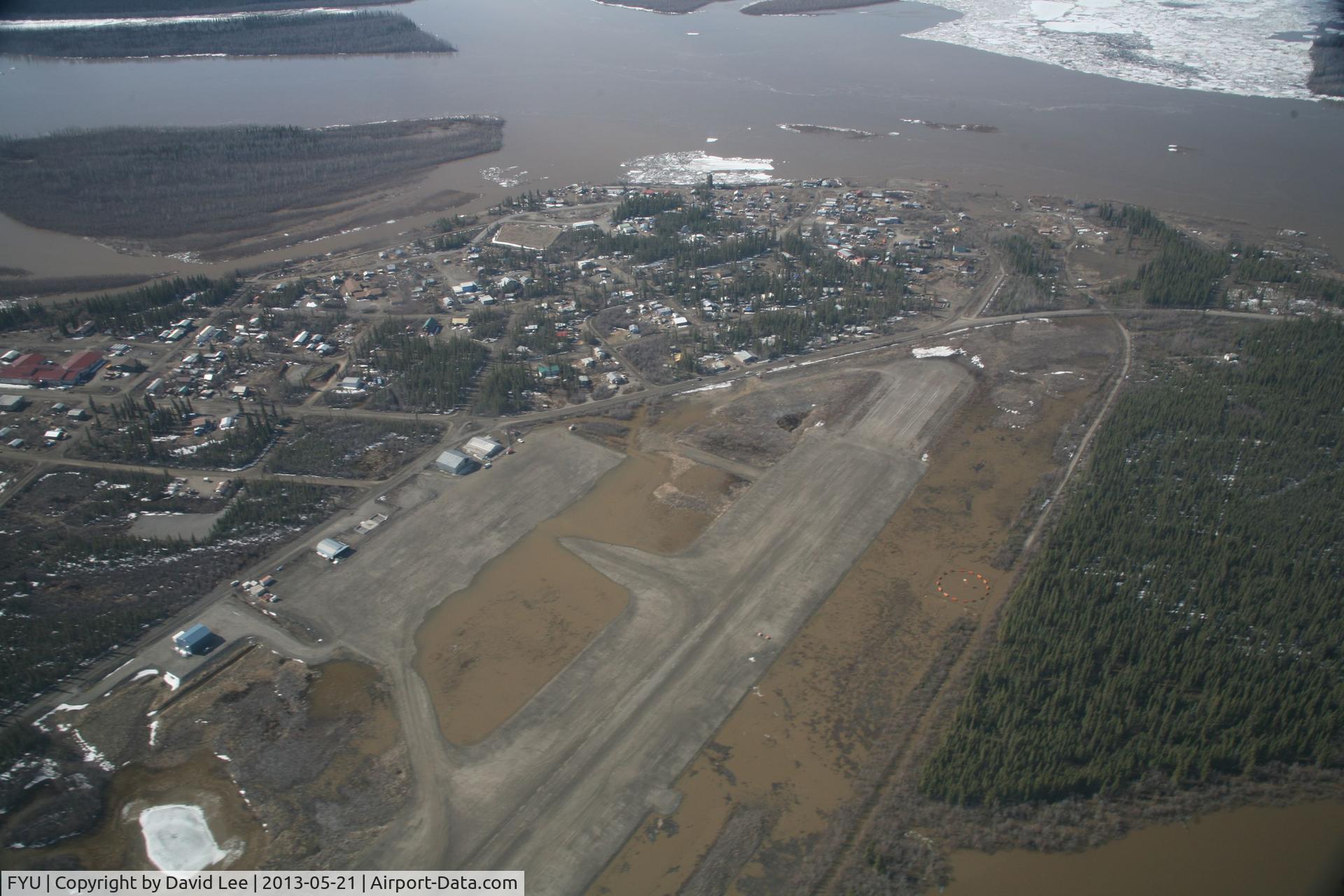 Fort Yukon Airport (FYU) - Fort Yukon, Alaska.  Minor flooding of ramp during breakup of Yukon River.  Taken from Wright Air N4637U piloted by Dave Lorring.