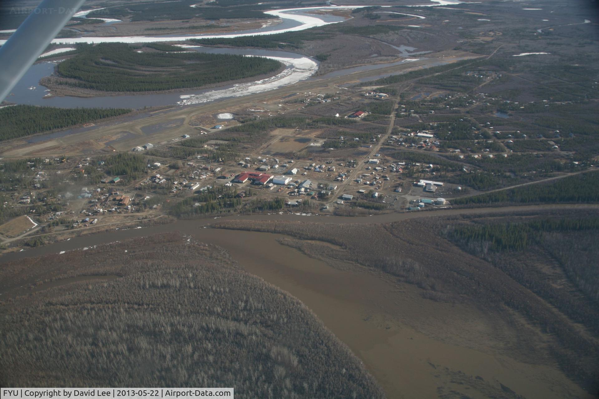 Fort Yukon Airport (FYU) - Fort Yukon, Alaska.  Minor flooding of ramp during breakup of Yukon River.  (River seen in picture flows into the Yukon which is to the left of the image)  Taken from Wright Air N4637U piloted by Dave Lorring.