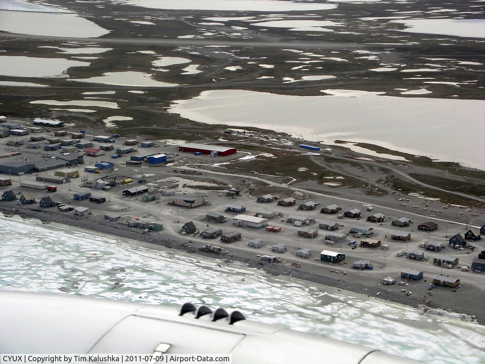 Hall Beach Airport, Hall Beach, Nunavut Canada (CYUX) - Abeam the airport from overhead the community of Hall Beach.