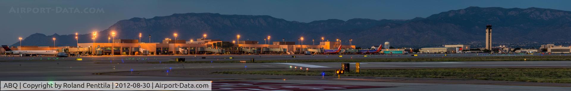 Albuquerque International Sunport Airport (ABQ) - Airport Terminal and tower as seen from field.