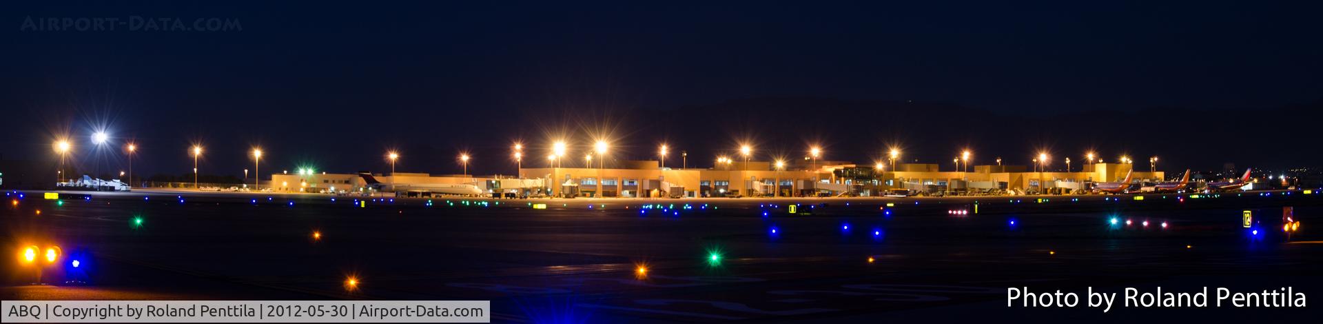 Albuquerque International Sunport Airport (ABQ) - Albuquerque's International Terminal (Sunport) at night from the runway side.