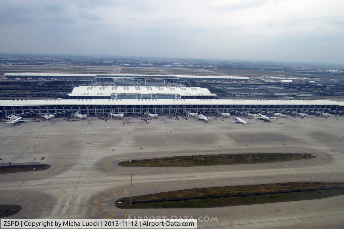 Shanghai Pudong International Airport, Shanghai China (ZSPD) - Terminals 1 (background) and 2 (foreground) are clearly visible