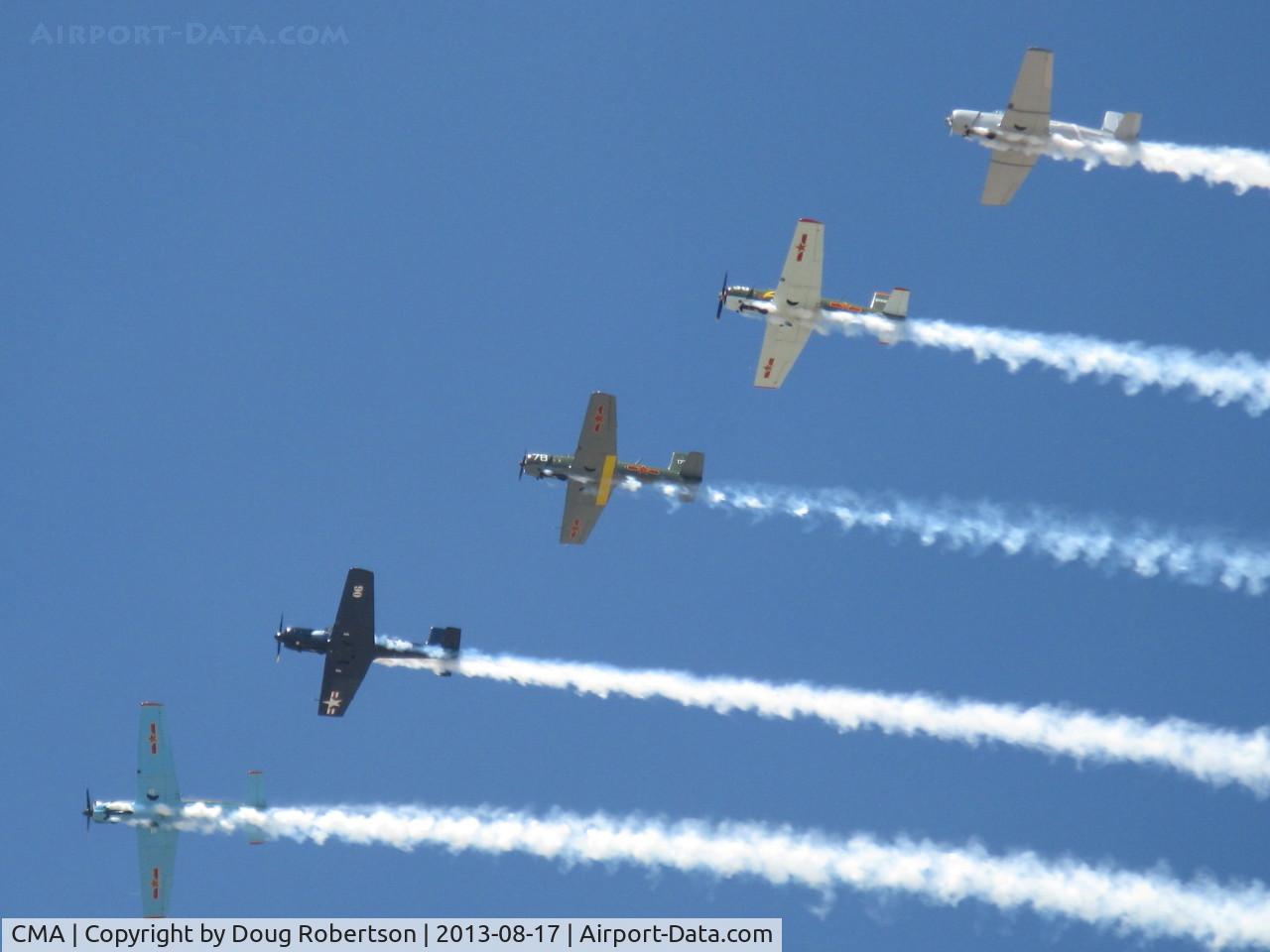 Camarillo Airport (CMA) - Warbirds in echelon flight with smoke over CMA