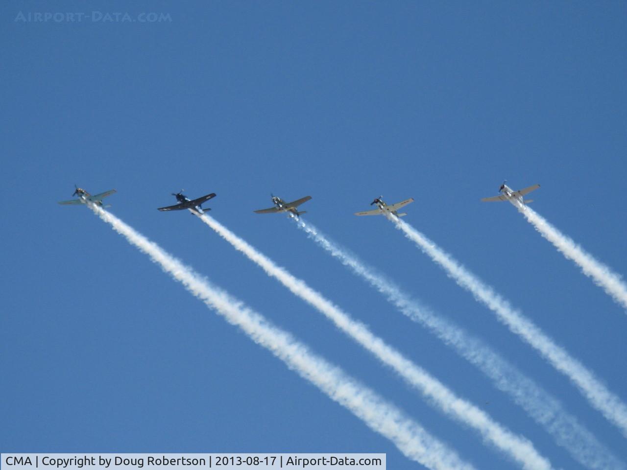 Camarillo Airport (CMA) - Warbirds in echelon flight with smoke over CMA